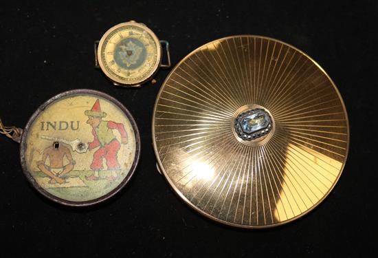 A German tinplate Indu optical illusion toy, Lehmann, c 1933, a 9ct gold-cased watch (a.f) and a powder compact